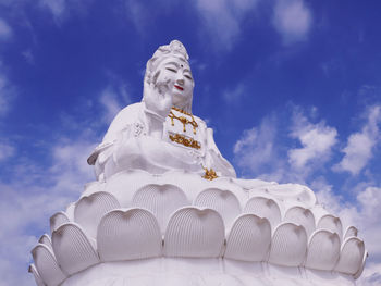 Low angle view of statue against sky