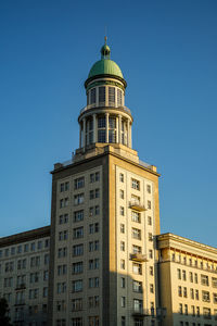 Low angle view of building against blue sky