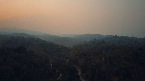 Scenic view of mountains against sky during sunset