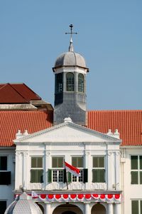 High section of building against blue sky