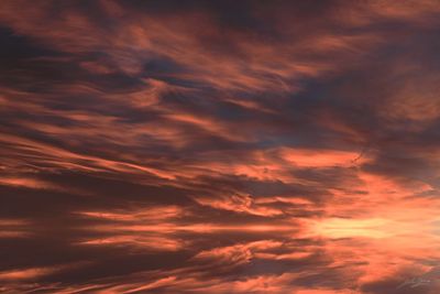 Low angle view of dramatic sky during sunset