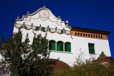 Low angle view of building against blue sky