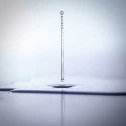 Close-up of drop falling on water surface