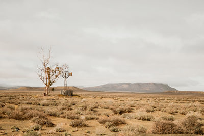 Scenic view of arid landscape against sky