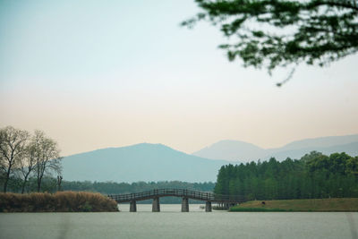 Bridge over river against sky