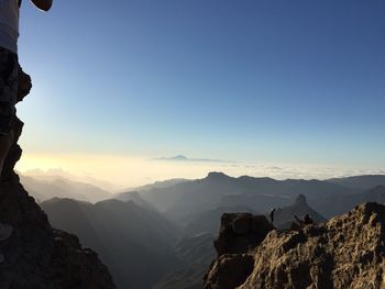 Panoramic view of mountains against clear blue sky