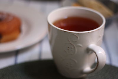 Close-up of coffee cup on table