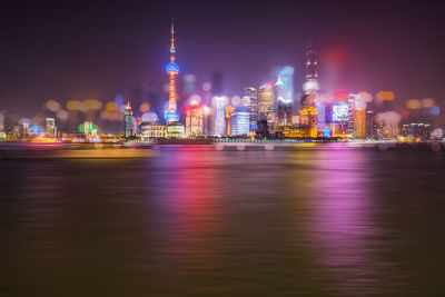 Illuminated buildings in city at night