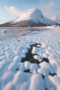 Snow covered mountain against sky