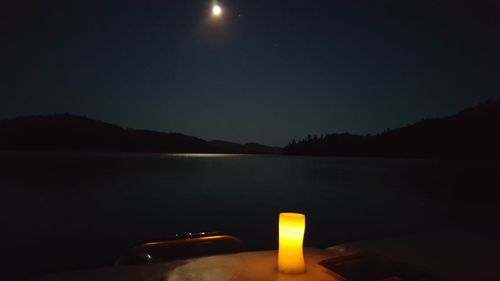 Scenic view of mountains against sky at night