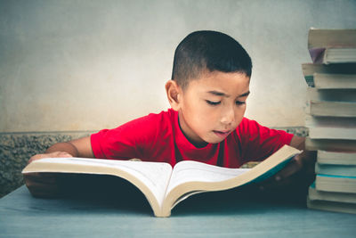 Boy looking at book