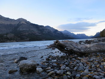 View of rocks on beach against sky