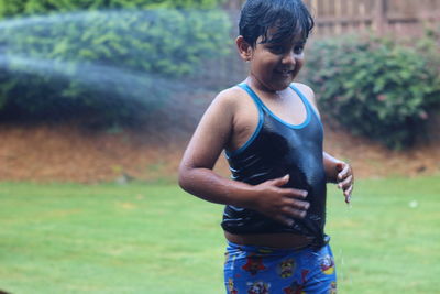 Boy standing on field