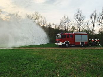 Truck on field against sky