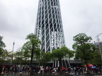 Group of people at observation point against sky