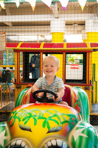 Portrait of smiling boy in amusement park