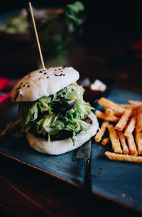 Close-up of burger in serving tray on table