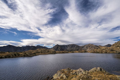 Scenic view of lake and mountains against sky