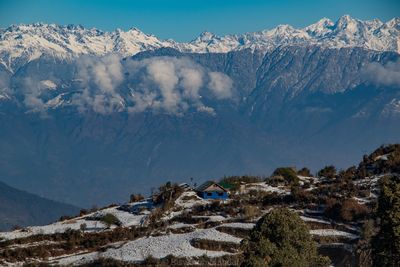 Scenic view of snowcapped mountains against sky