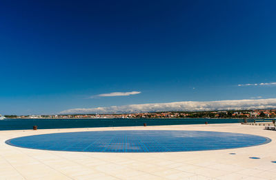 Swimming pool against blue sky