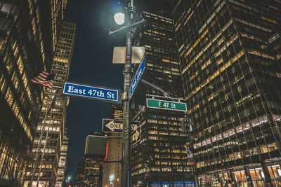 Low angle view of illuminated buildings at night