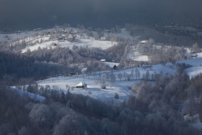 Rural mountain landscape in transylvanian village, in winter season