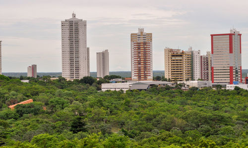 Modern buildings in city against sky