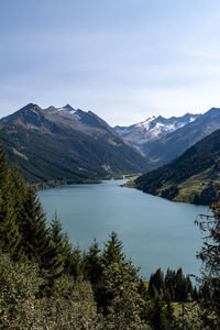 Scenic view of lake and mountains against sky