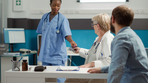 Doctor examining patient in hospital