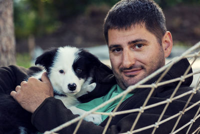 Portrait of man with dog