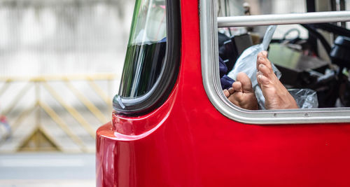 Midsection of man driving car