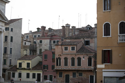 Low angle view of buildings in city against sky