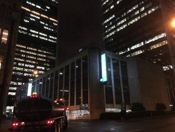 Illuminated city street at night