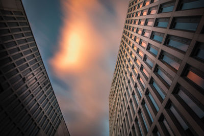 Low angle view of buildings against sky during sunset