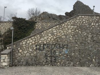 Graffiti on building against sky