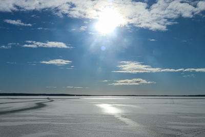 Scenic view of sea against sky on sunny day