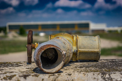 Close-up of rusty pipe on railing