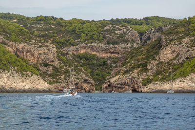 Scenic view of sea against mountain