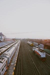 Train at railroad station against clear sky