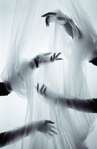 Low angle view of woman dancing against sky