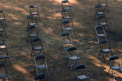 High angle view of chairs on field