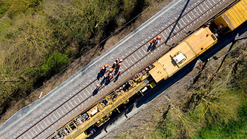 High angle view of people on railroad tracks