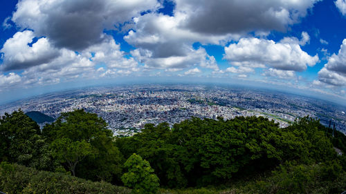 Aerial view of city against sky