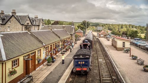 High angle view of train amidst buildings in city