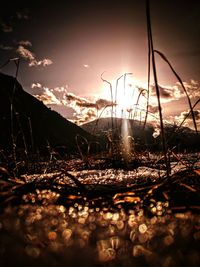 Scenic view of landscape against sky at sunset