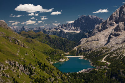 Scenic view of lake and mountains against sky