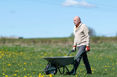 Portrait of man standing on field