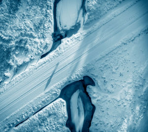 It's all just water under the bridge. tidal marsh area covered in snow and ice. lummi island, wa.