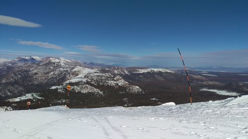 Snow covered landscape against sky