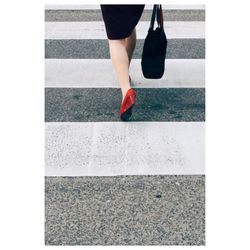 Woman standing on road